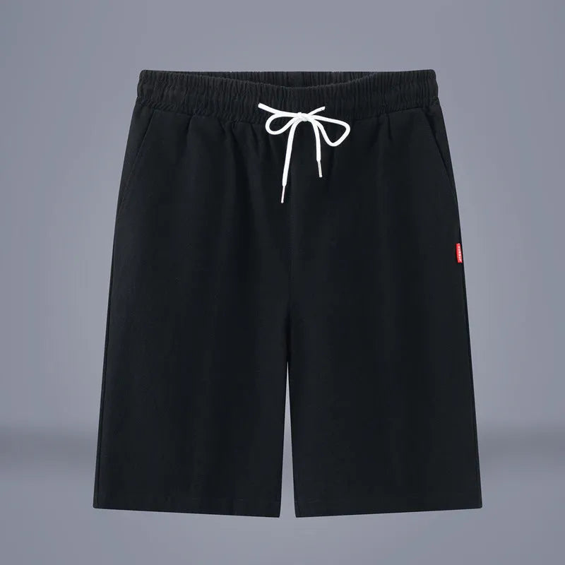 Solid colour cotton-linen cropped trousers with a drawstring waist on a hanger.
