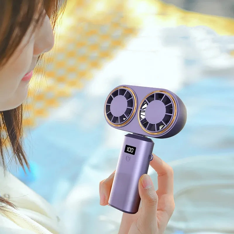 USB handheld mini fan folded showing digital display, available in milky white, pink, and dark blue colours
