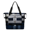 Foldable travel duffel bag in black Oxford cloth with dry wet separation and shoe compartment, 20-35L capacity.