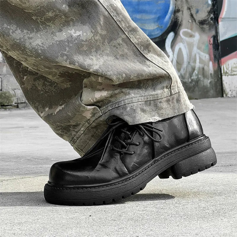 Black platform shoes with round toe and low top design for height enhancement