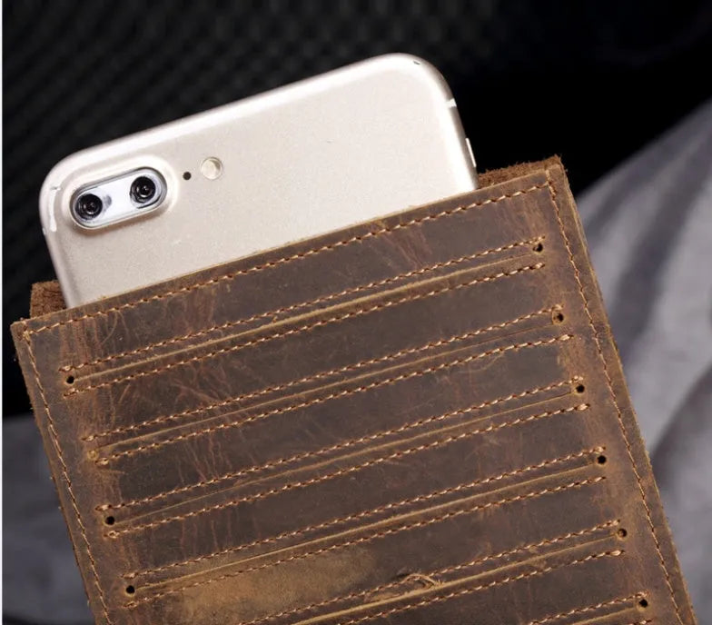 Slim black leather men's wallet open to show 18 card slots and a central mobile phone pocket.