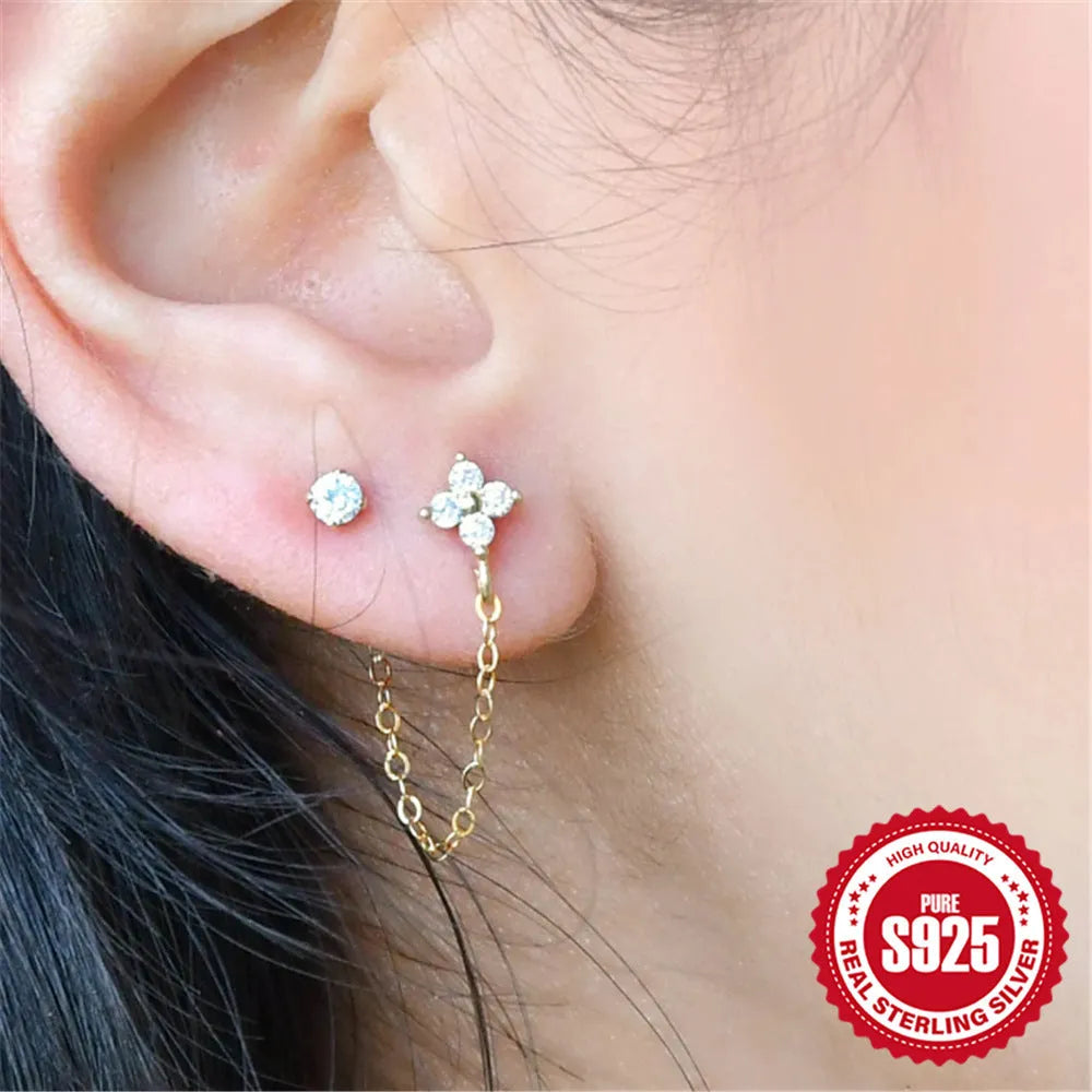 S925 sterling silver geometric earring with flower, tassel and chain detail in gold electroplated finish.