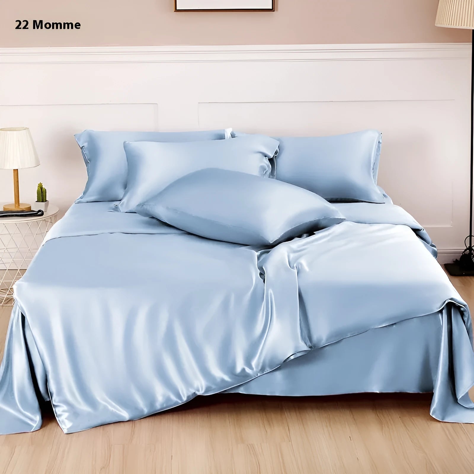 Double-sided silk duvet cover in plain weave, shown in one of six solid colours, laid flat on a bed.