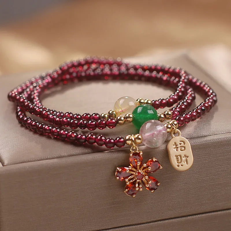 Natural crystal women's bracelet in pomegranate red cherry blossom colour with sequin detail
