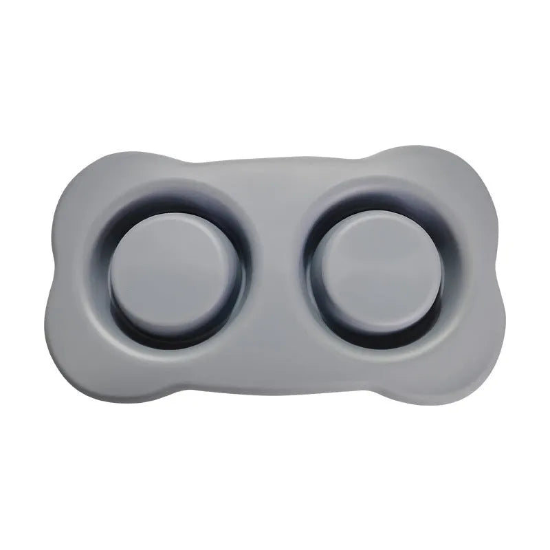 Large silicone double dog bowl with stainless steel inserts in blue colour showing two separate feeding compartments