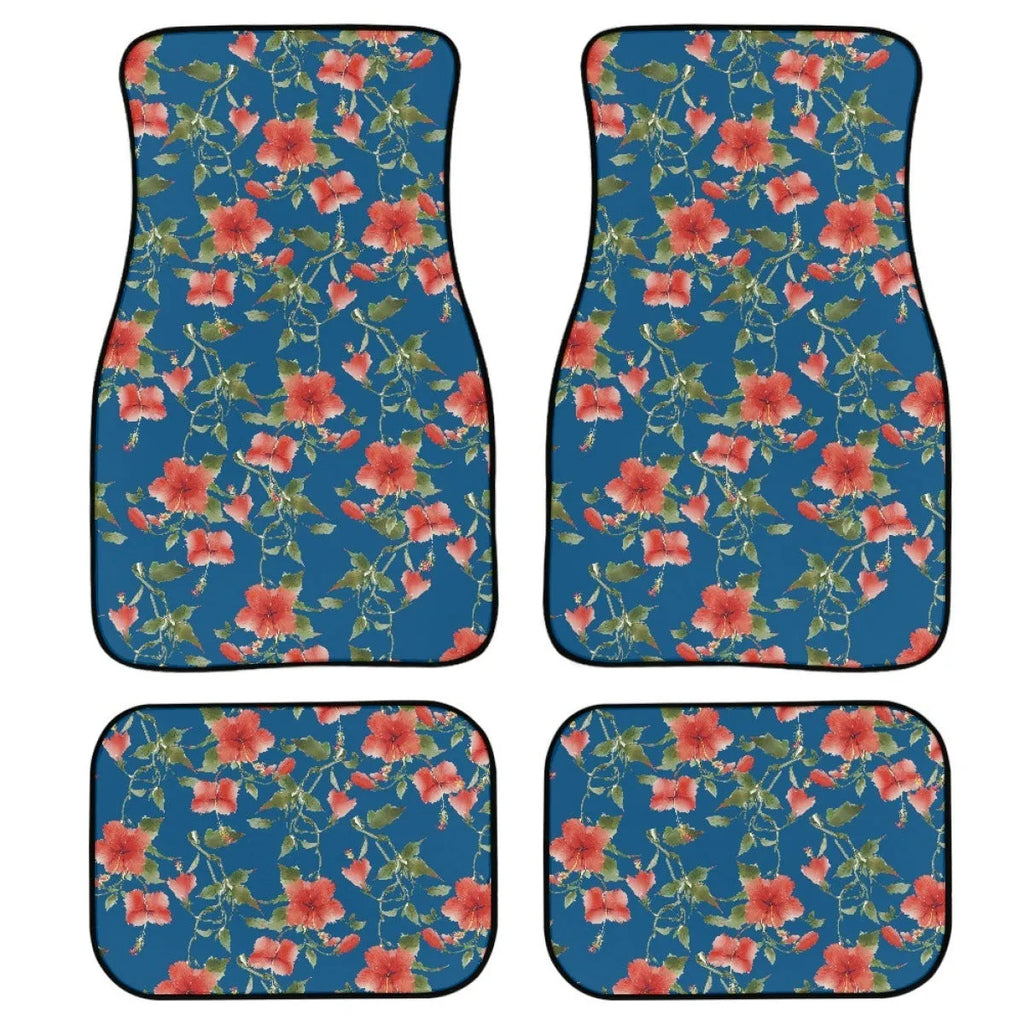 Four-piece set of black printed rubber car floor mats with textured surface.