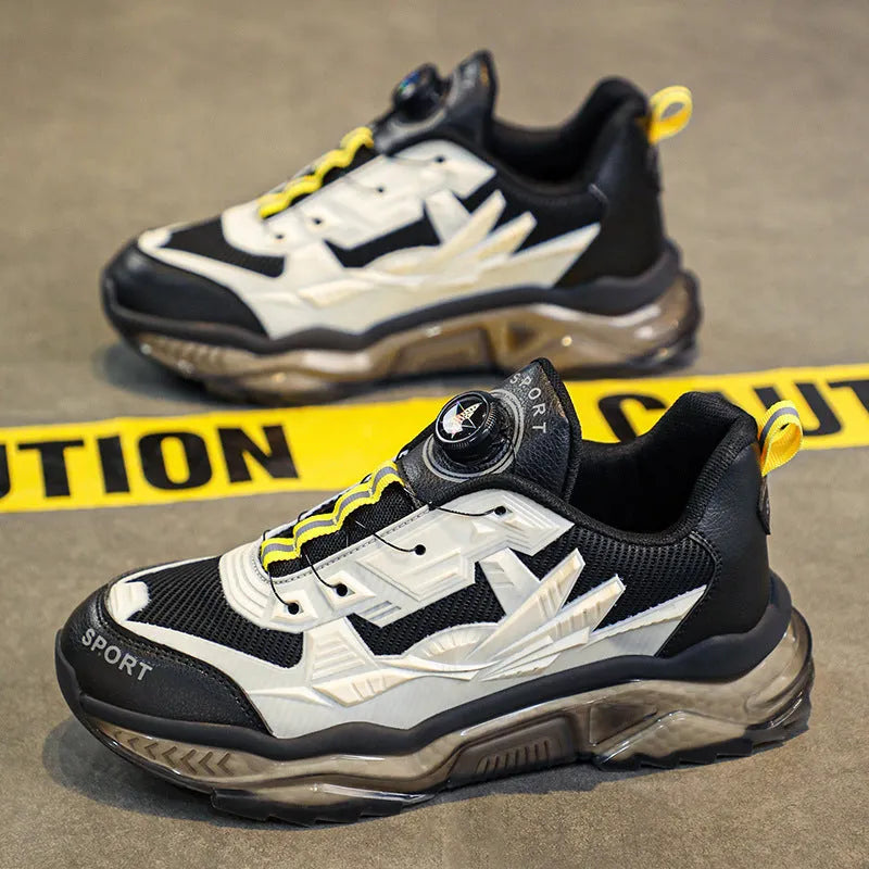 Men's black casual shoes with rotating button fastening and a low platform sole.
