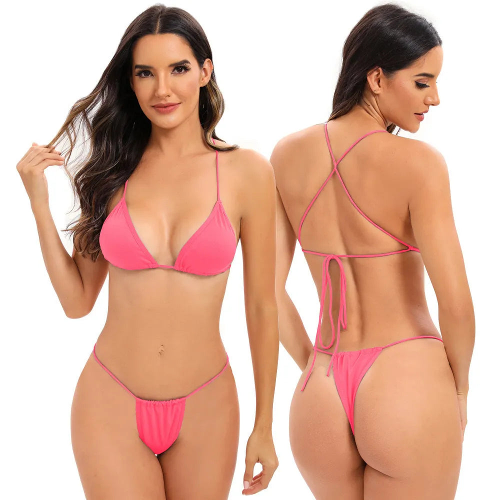 Women's candy coloured cross strap split swimsuit with multiple straps on a mannequin.