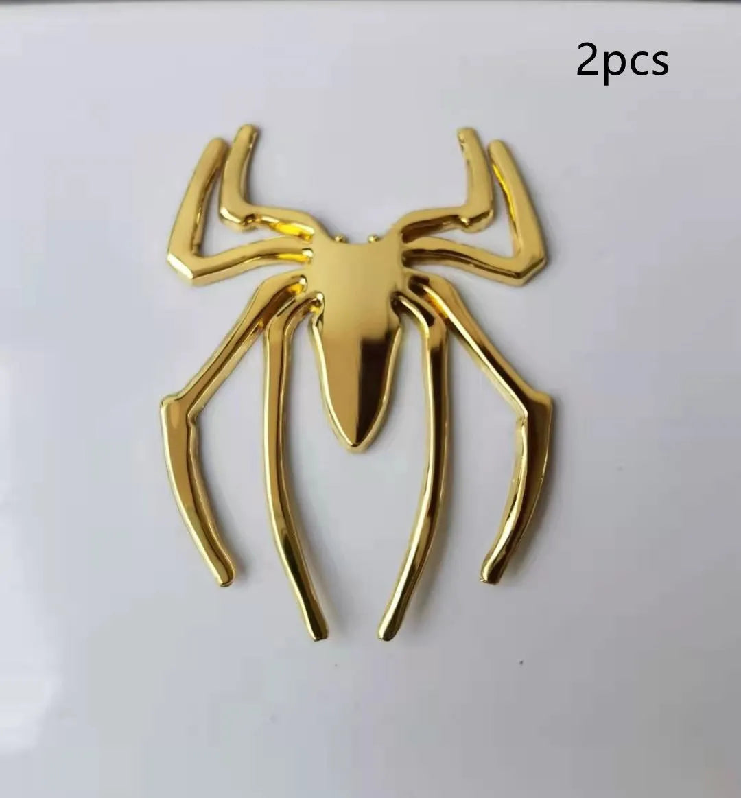 Three-dimensional metal spider car sticker in zinc alloy on a vehicle bumper.
