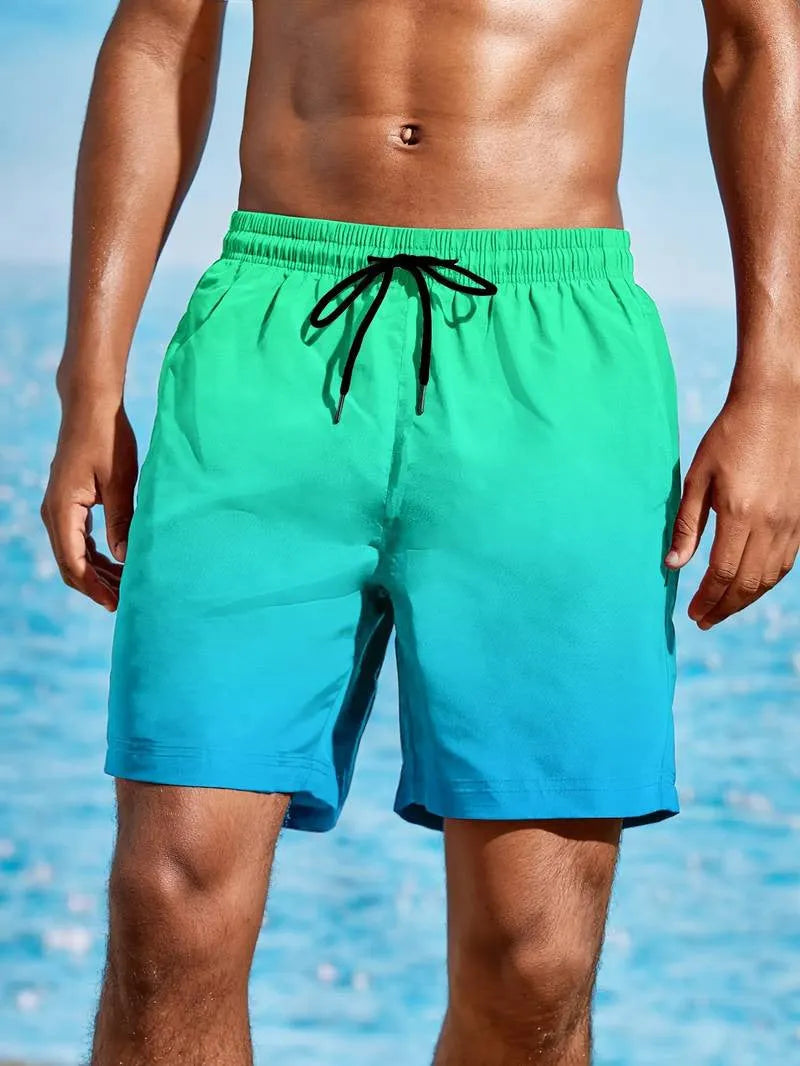 Man wearing grey 3D gradient print mesh sports shorts with micro elastic waistband.