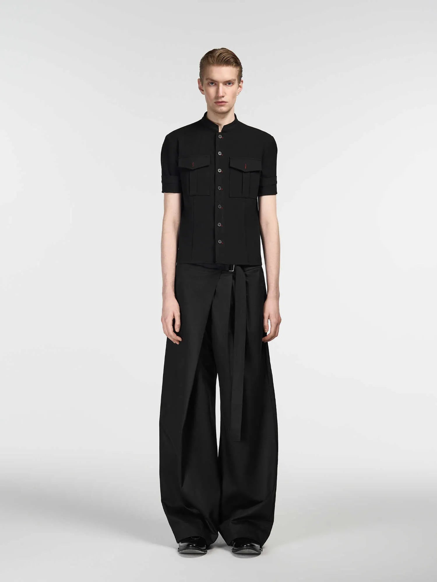 Black straight-leg trousers with adjustable waistband and single-pleat front detail