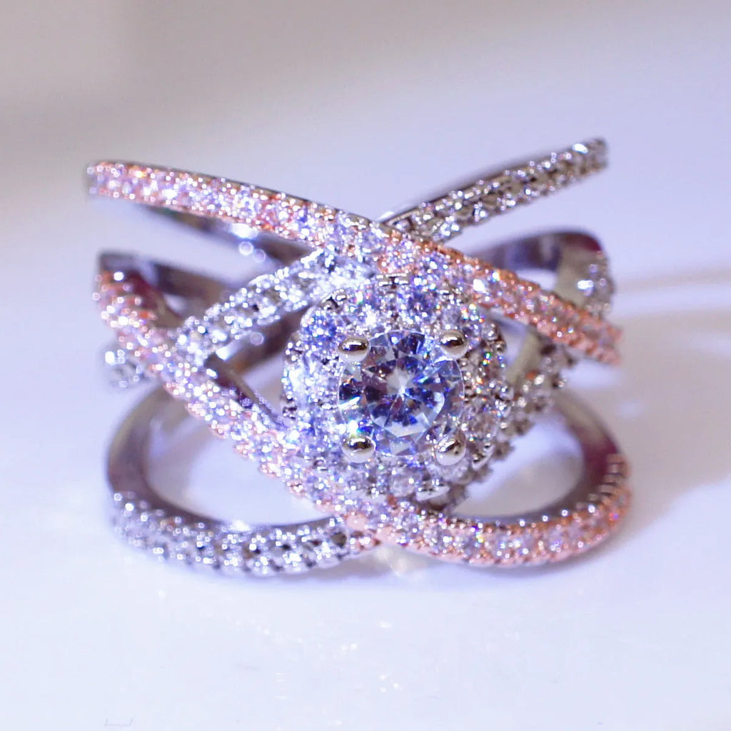 Women's geometric cross zircon engagement ring in copper with rose gold colour separation on display