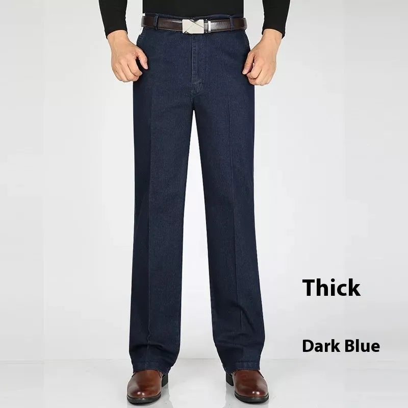 Men's high-waist loose fit blue denim jeans with zipper fly on size chart background