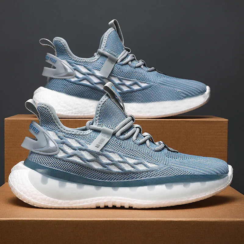Men's low-top mesh sneaker in light grey with flat rubber sole and front lace-up.