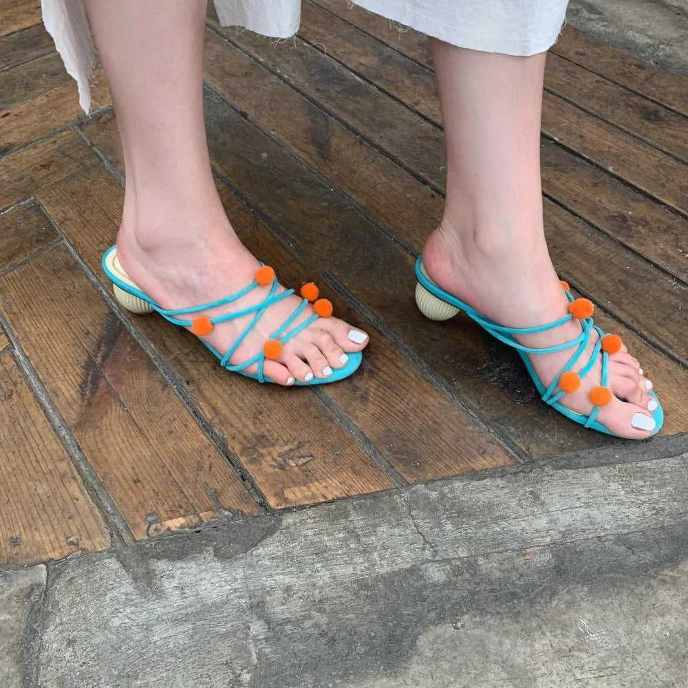 Cyan women's leather high-heel sandals with lace-up straps and ball decoration