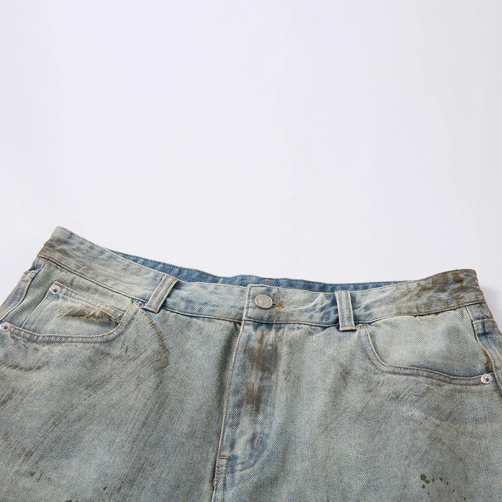 Washed blue women's cropped denim straight-leg trousers with zipper fly on a hanger