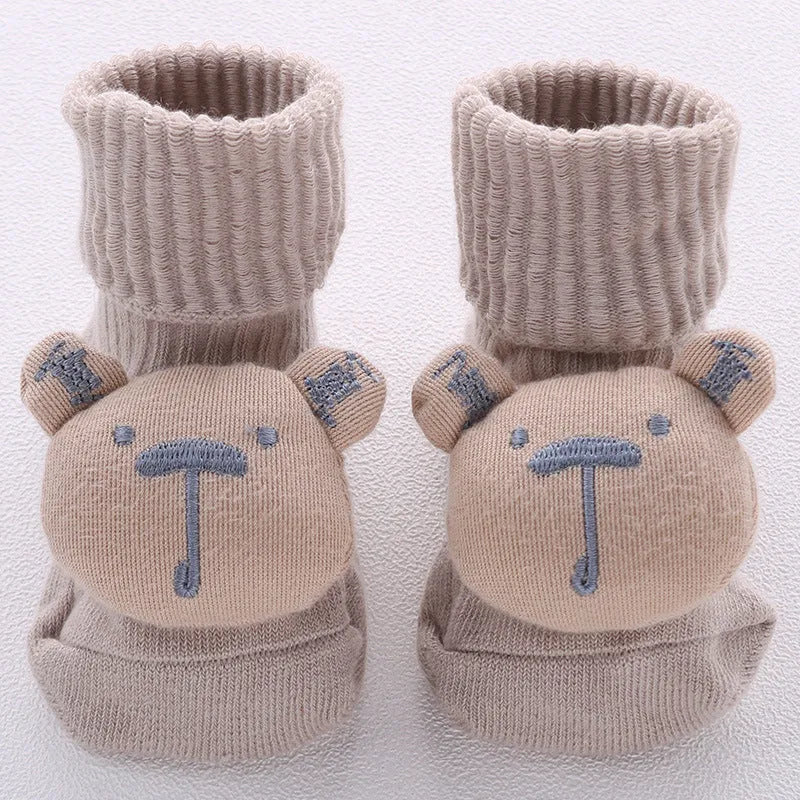 Cotton baby socks with non-slip soles in multiple designs including bows, stars, and animal prints.