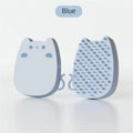 Brown sponge silicone pet hair removal brush with comb teeth on a wooden surface