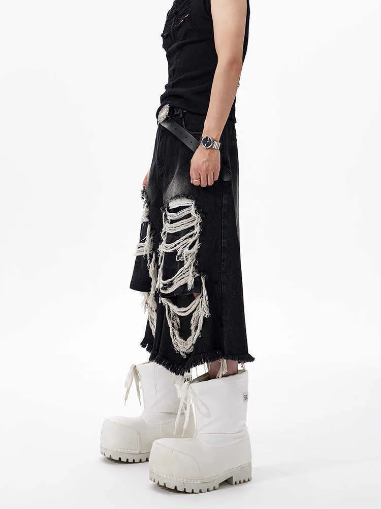 Black women's wide-leg cropped jeans with ripped patchwork details on cotton denim.