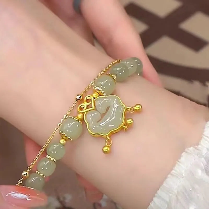 Green double-layer women's bracelet with safety lock bell pendant and drop-shaped charm