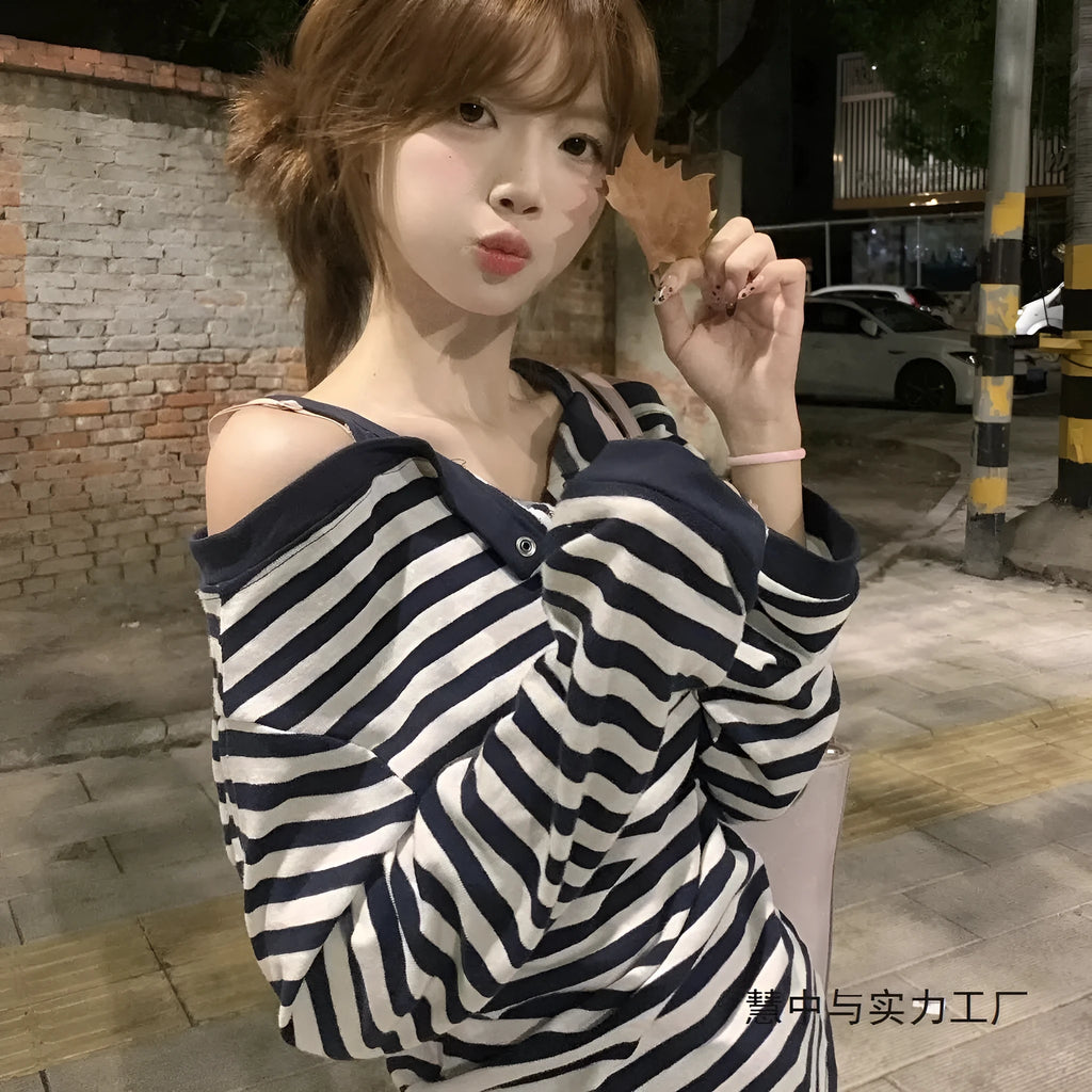 Dark blue Korean-style oversized women's long-sleeved t-shirt with stripes, buttons, and embroidery detail.