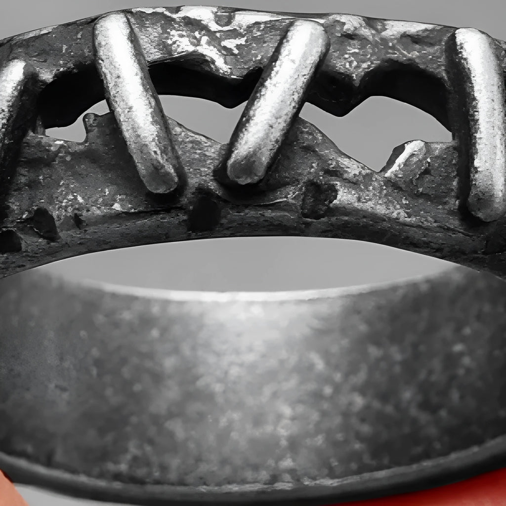 Stainless steel double ring with punk stitching style details in dark colour.