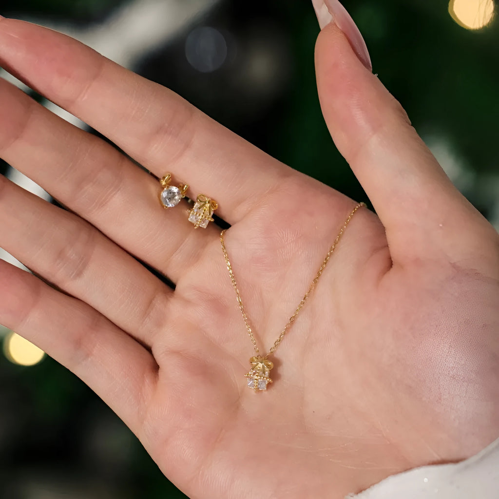 S925 sterling silver necklace and earring set with bear pendant in gold finish on display