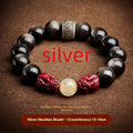 Hand-carved natural cinnabar bead bracelet with Jinniu animal design in gold or silver obsidian.