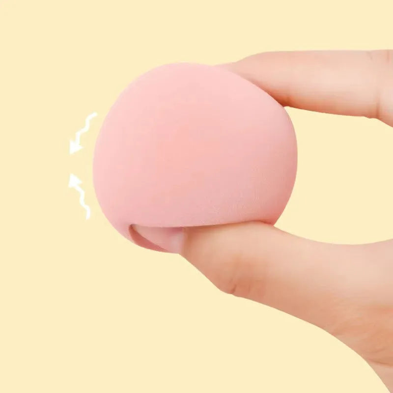 Set of 10 nude, pink and rose red hydrophilic non-latex makeup sponges in bevel drop and peach heart shapes.