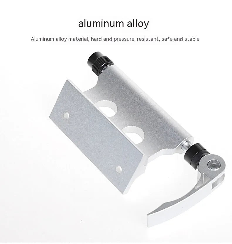Silver metal quick release fixing clip for bicycle front fork on a white background