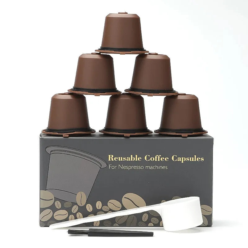 Six recyclable coffee shell filter cups in black, brown, and red plastic with a spoon
