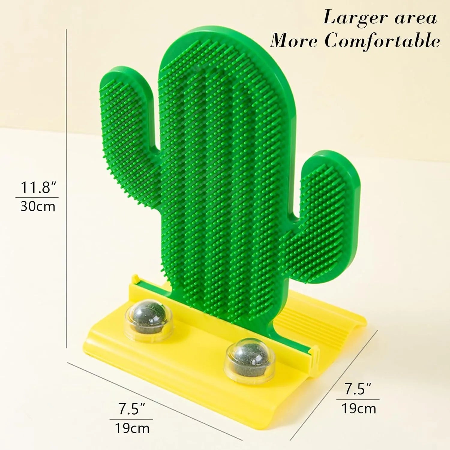Green cactus-shaped cat self groomer with two catnip balls attached to a wall corner