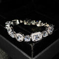 Geometric women's silver bracelet with zircon stones, shown in two length options.