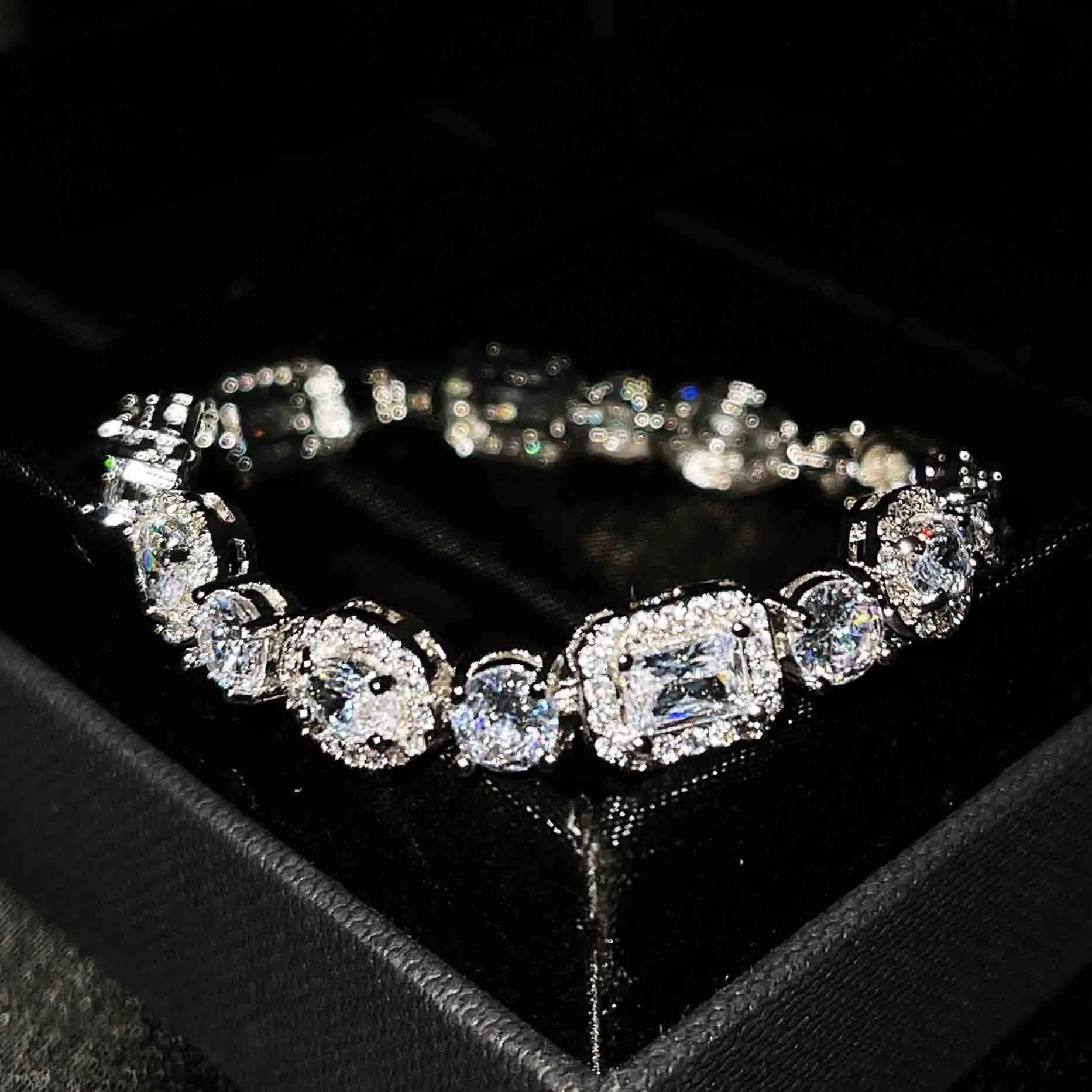 Geometric women's silver bracelet with zircon stones, shown in two length options.