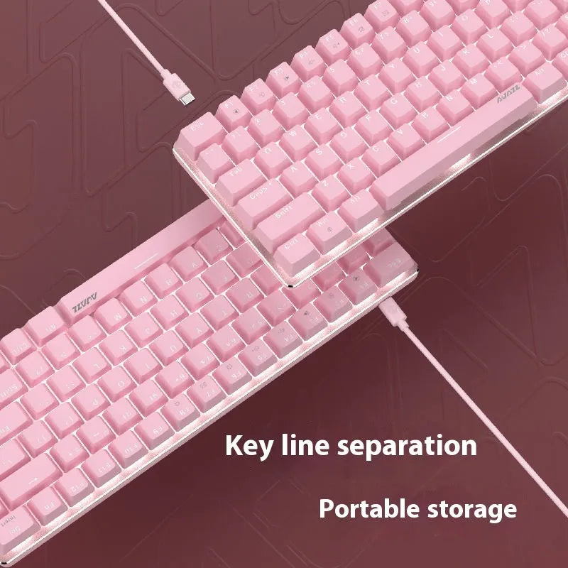 Compact white-backlit mechanical keyboard with 82 keys and metal body next to a laptop.