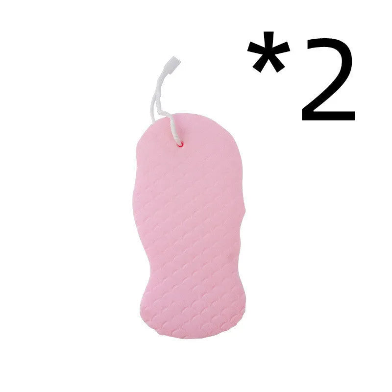 White 3D bath sponge with fish scale pattern for gentle body exfoliation in shower.