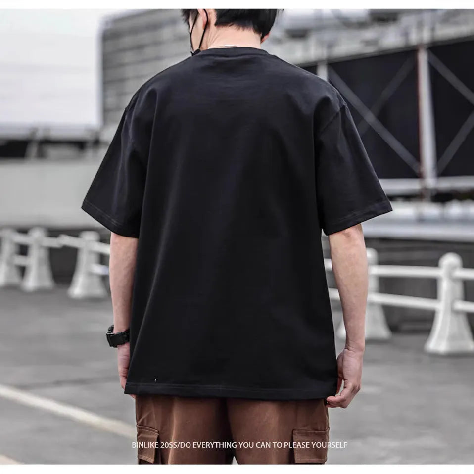 Men's short sleeve simple printed top in combed cotton available in brown, black, and white