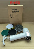 White cordless electric cleaning brush with interchangeable scrubber heads on a kitchen counter