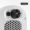 White ceramic heating electric hot air blower with remote control on a desk