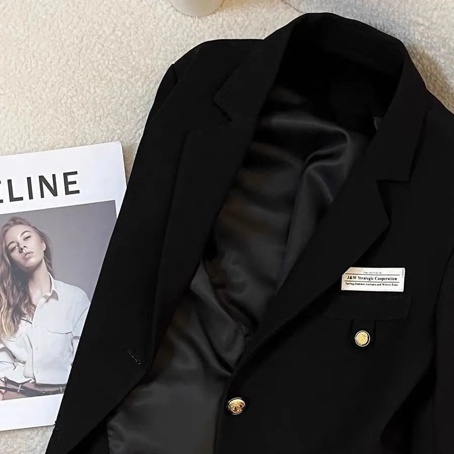 Women's black polyester suit coat with loose fit design and long sleeves for smart casual wear