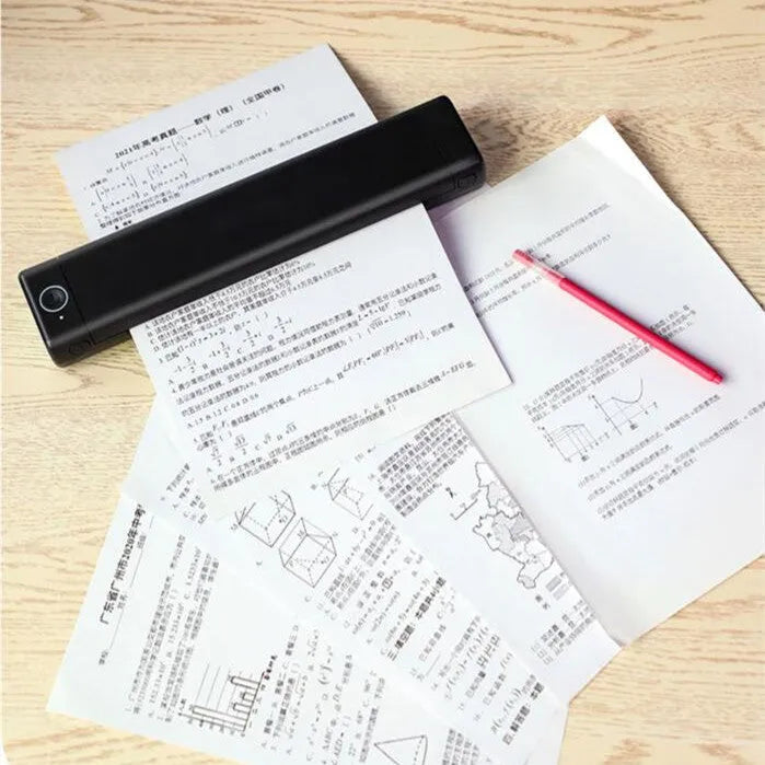 Phomemo M08F white A4 portable thermal printer with USB cable on a wooden desk