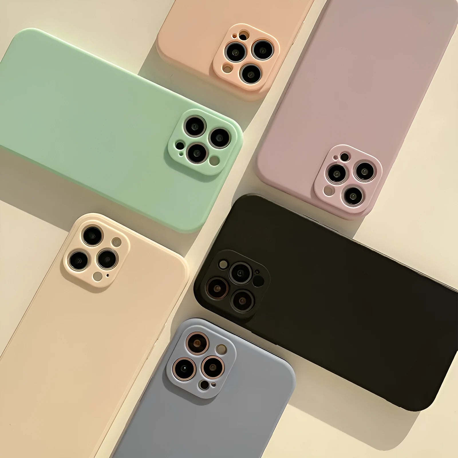 Frosted matte silicone phone case for iPhone 14 on a table, showing the slate blue colour option.