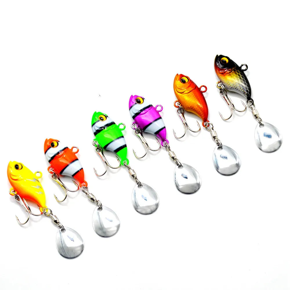 Metal fishing lure with rotating sequins in zebra stripe, gold, and lightning colour patterns.