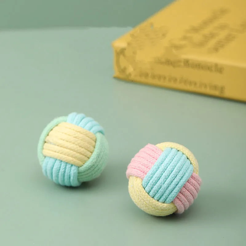 Handmade small blue powder and green plush cotton ball cat toy for teeth grinding.