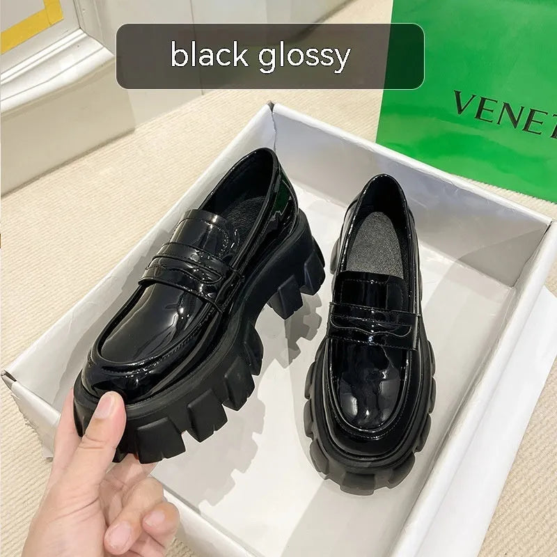 A pair of British style wide fit loafers in patent leather and matte finish options.