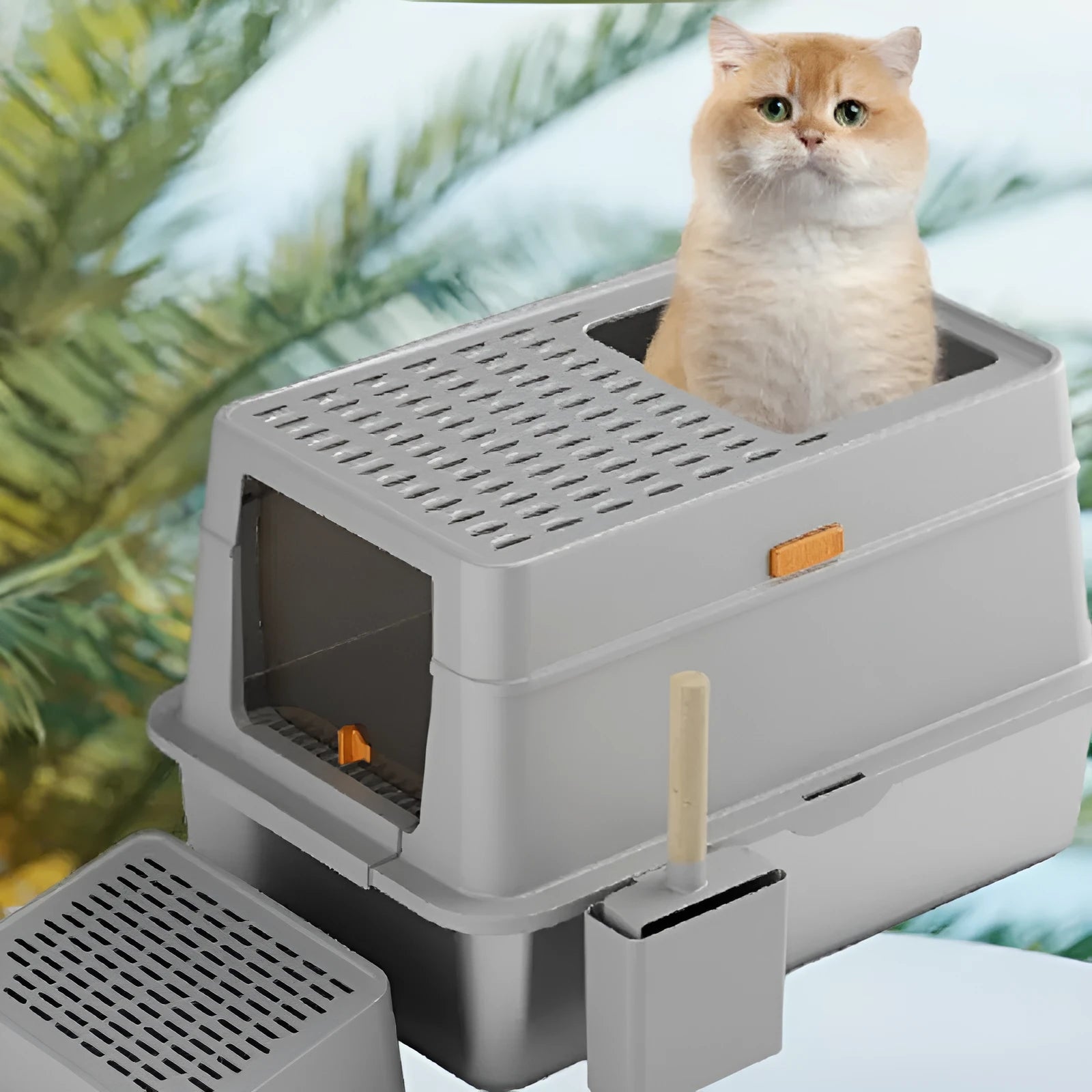 Grey enclosed cat litter box with a foot pedal open, showing the stainless steel dustbin inside.