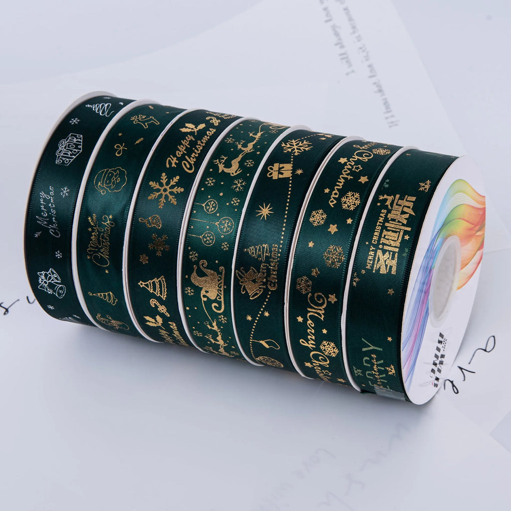 2.5cm Christmas polyester ribbon roll 22m in Ink Green or Red with Elk, bell, Santa, Sled, or Snowman design