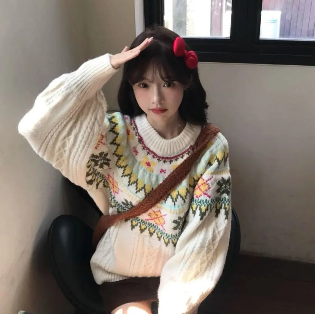 Milky white women's pullover sweater with lantern sleeves and a loose fit.