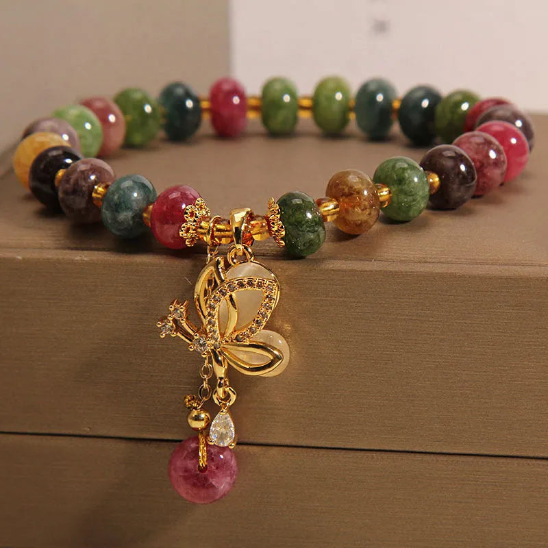 Colourful tourmaline bead and butterfly charm on women's alloy bracelet