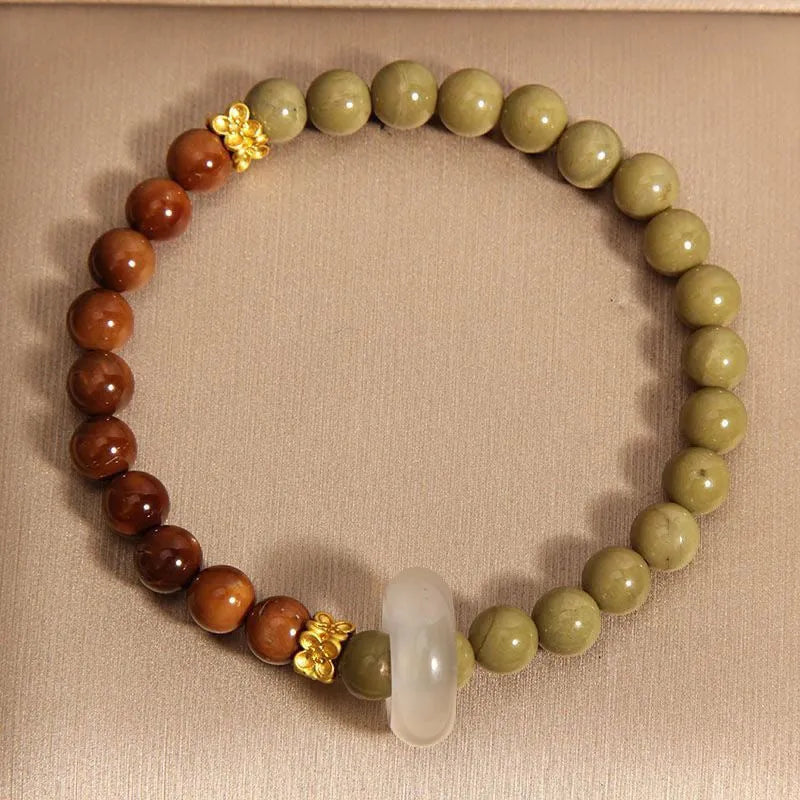 Green gradient Chinese style bracelet with crown and diamond motifs on mixed materials